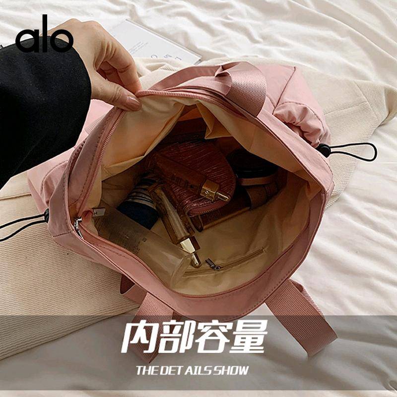 ALO YOGA💰98💎支持一件代发
aloyoga单肩包纯色大容量瑜伽休闲通勤手提包
【品牌】ALO 
【款号】JY90002
【面料】尼龙
【颜色】黑色，粉红色，灰色，卡其色
【尺码】均码
 专柜同款品质，厂家直销，货源充足，售后保障
