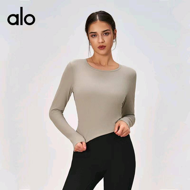 ALO YOGA 💰78💎支持一件代发
alo袖速干衣运动透气薄款圆领侧褶皱修身长袖健身服上衣
【品牌】ALO 
【款号】CX115
【面料】锦纶/尼龙
【颜色】暮色玫瑰，生亚麻色，时尚黑，象牙白
【尺码】S，M，L，XL
 专柜同款品质，厂家直销，货源充足，售后保障